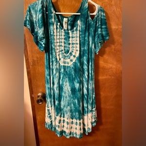 Can be worn as dress or top. Loose fitting.